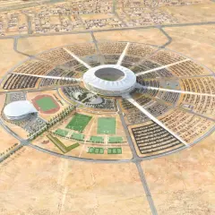 Okrągły kompleks sportowy z centralnym stadionem, otoczony parkingami i boiskami. To wizualizacja King Abdullah Sports City.
