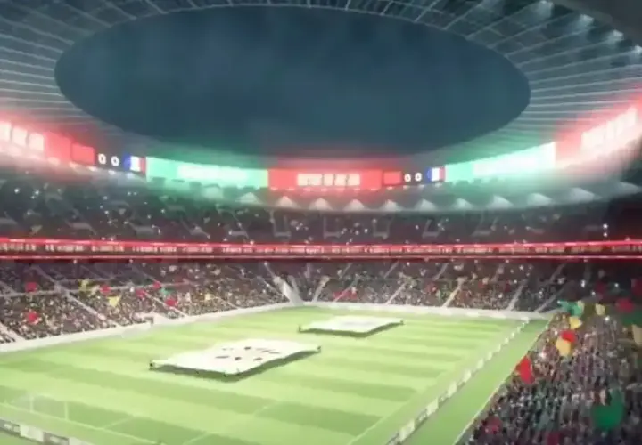 Widok na wypełniony po brzegi, największy stadion na świecie. Na murawie rozłożone wielkie transparenty, a trybuny rozświetlone flagami i światłami.