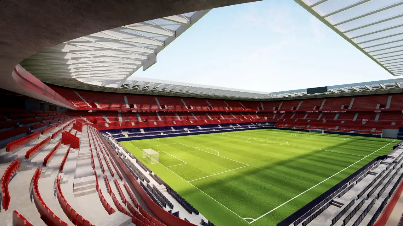 Nowoczesny stadion El Sadar z zieloną murawą i czerwonymi trybunami, gotowy na emocjonujące mecze.