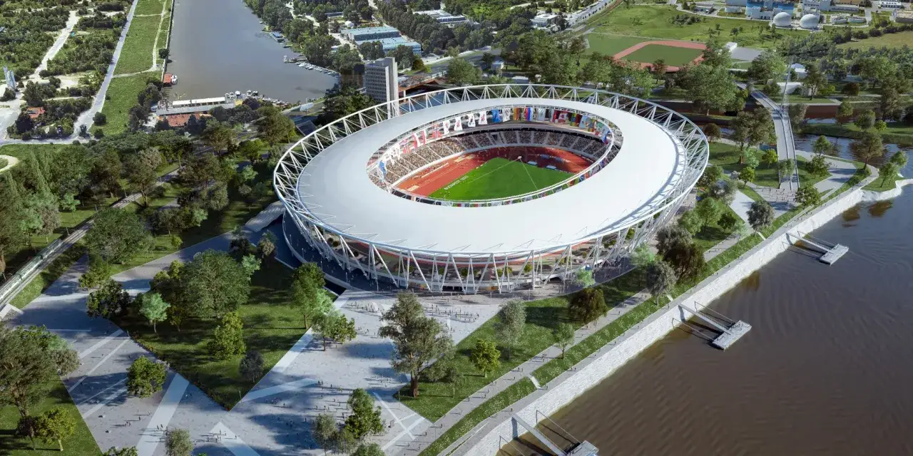 Nowoczesny stadion w Budapeszcie, otoczony zielenią i rzeką, gotowy na wielkie wydarzenia sportowe.
